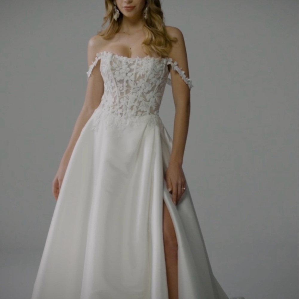 Luxury off shoulder wedding gown by Sophia Tolli